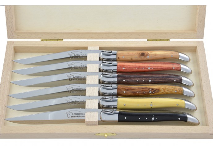 Laguiole steak knives with shiny stainless steel bolsters. Wide various wood handles