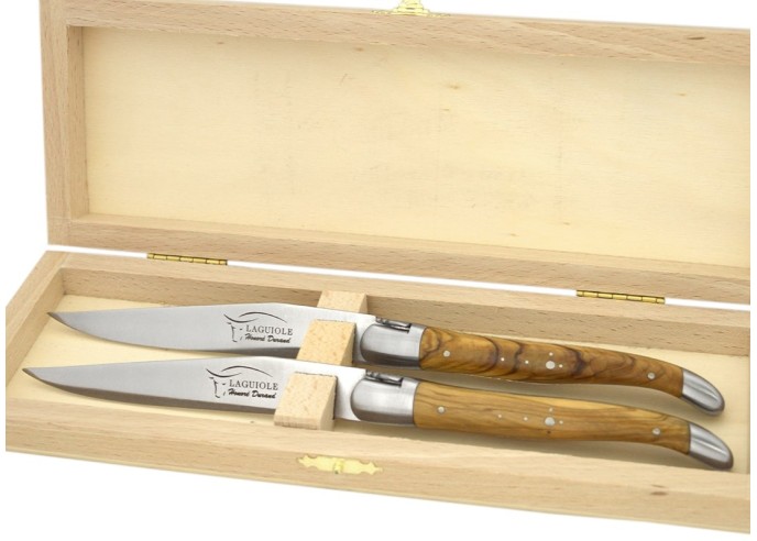 Laguiole steak knives with shiny stainless steel bolsters. Slim olive wood handles
