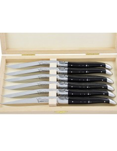 Laguiole steak knives with shiny stainless steel bolsters. Wide ebony wood handles