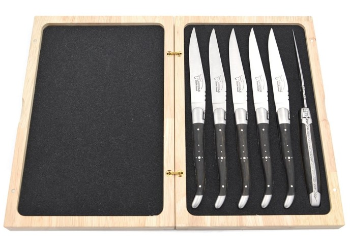 Laguiole steak knives with matt stainless steel bolsters. Wide ebony wood handles