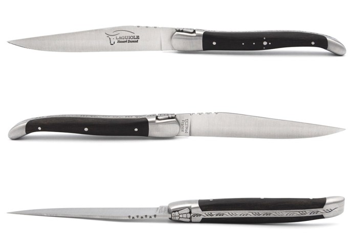 Laguiole steak knives with matt stainless steel bolsters. Wide ebony wood handles