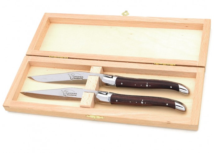 Laguiole steak knives with shiny stainless steel bolsters. Slim purplewood handles