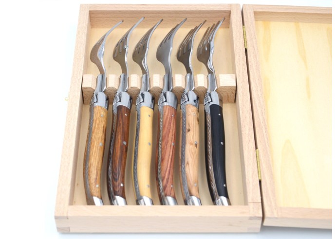 Laguiole forks with shiny stainless steel bolsters. Wide various wood handles