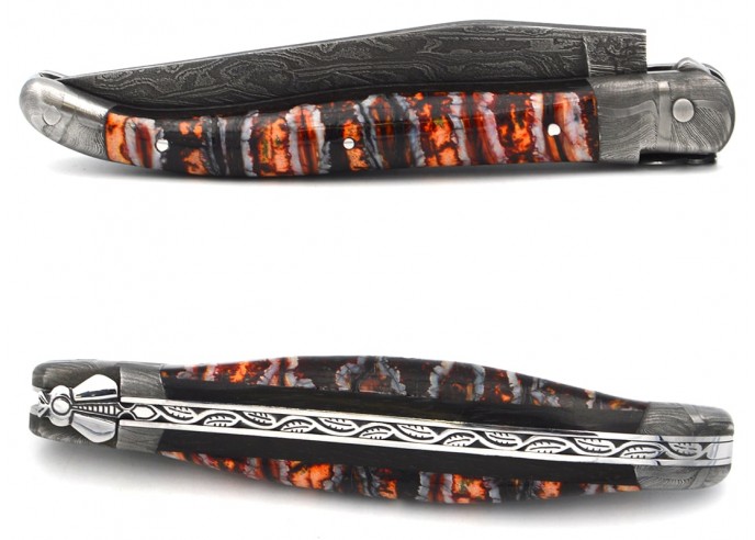 Red-orange Mammoth molar with Damascus steel bolsters