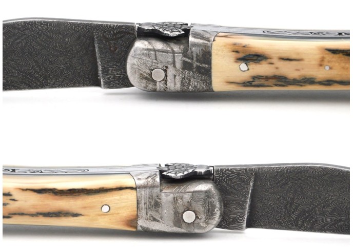 Laguiole folding knife 12 cm, damascus bolster and blade, chiselled spring, warthog tooth handle