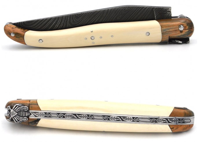 Laguiole knife with mammoth tusk handle and bolsters and wild Damascus steel blade