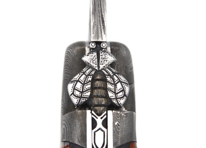 Orange Mammoth molar with Damascus steel bolsters