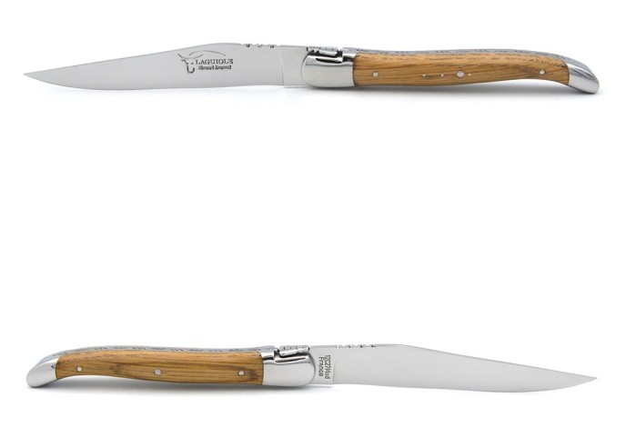 Laguiole steak knives with shiny stainless steel bolsters. Wide barrel oak handles