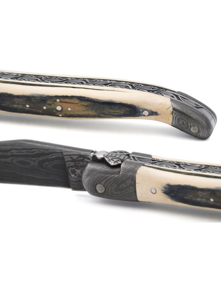 Mammoth tusk with Damascus steel bolsters